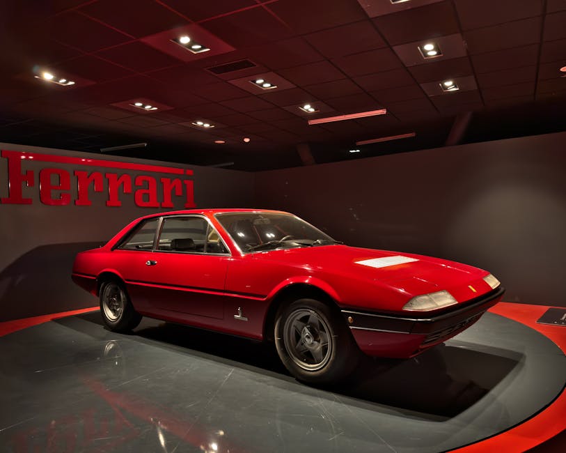 Classic red Ferrari showcased at an automotive museum in Turin, Italy. Iconic Italian design.