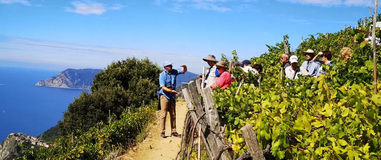 tourist guide explaining the cinque terre to his guests