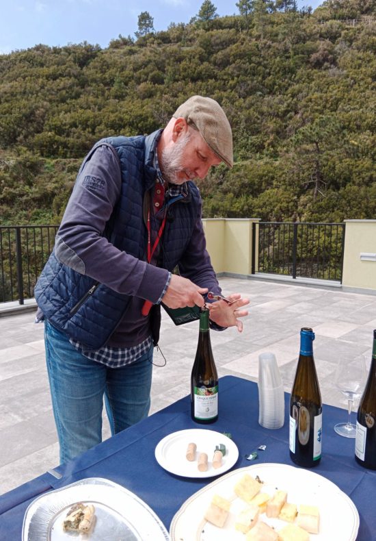 local guide while opening a bottle of cnque terre wine